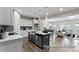 Open kitchen with an island, seamlessly flowing into the living and dining area at 67 Little Leaf Ln # 98, Clayton, NC 27527