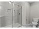 Modern shower with tile surround and glass enclosure at 67 Little Leaf Ln # 98, Clayton, NC 27527