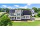 Beautiful two-story home featuring solar panels and a well-maintained lawn in a Gathering-friendly neighborhood at 73 Lynnville Ct, Lillington, NC 27546