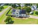 Spacious home with solar panels, fenced yard, playground, and convenient circular driveway at 73 Lynnville Ct, Lillington, NC 27546