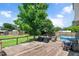Spacious wooden back deck with outdoor furniture, grill, and above ground pool, perfect for entertaining at 73 Lynnville Ct, Lillington, NC 27546