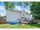 Backyard with pool, deck, and outdoor seating, perfect for summer gatherings and relaxation at 73 Lynnville Ct, Lillington, NC 27546