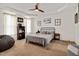 Calm, spacious bedroom with neutral tones, tray ceiling, ceiling fan, and stylish furnishings at 73 Lynnville Ct, Lillington, NC 27546