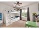 ' bedroom featuring a bunk bed with stairs, playful decor, and natural light from a window at 73 Lynnville Ct, Lillington, NC 27546