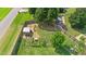 Expansive backyard with a large chicken coop, vegetable gardens, and a thriving green lawn at 73 Lynnville Ct, Lillington, NC 27546