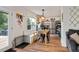 Eat-in kitchen with stainless appliances, beautiful open wooden shelving, and a sun-filled dining area at 73 Lynnville Ct, Lillington, NC 27546