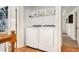 Convenient laundry room with modern washer and dryer, and shelving for supplies at 73 Lynnville Ct, Lillington, NC 27546