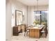 Elegant dining room with a wooden table, modern lighting, and large windows providing natural light at 8016 Penny Rd, Raleigh, NC 27606