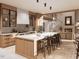Modern kitchen with a large island, bar stools, and custom cabinets, perfect for cooking and entertaining at 8016 Penny Rd, Raleigh, NC 27606