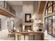 Spacious living room featuring a fireplace, high ceilings, and large windows, providing ample natural light at 8016 Penny Rd, Raleigh, NC 27606