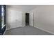 A bedroom featuring neutral paint, carpet flooring, a large closet with doors and a window at 813 Old Tarboro Rd, Wendell, NC 27591