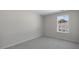 Neutral bedroom with carpet and window overlooking exterior of home at 813 Old Tarboro Rd, Wendell, NC 27591