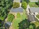 This beautiful home features a deck, mature trees, a storage shed, and a spacious yard at 908 Clarion Dr, Durham, NC 27705