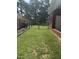 View of the fenced backyard showing ample space for gardening, play and relaxation at 908 Clarion Dr, Durham, NC 27705