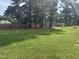 An expansive backyard offering ample space for recreation and outdoor activities, enhanced by mature trees at 908 Clarion Dr, Durham, NC 27705