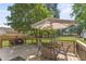 Backyard deck with an umbrella-shaded table overlooking the lawn at 908 Clarion Dr, Durham, NC 27705