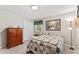 Bright bedroom showcasing a cozy bed, dresser, and a large closet for storage at 908 Clarion Dr, Durham, NC 27705