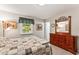 Comfortable bedroom with a bed, a large dresser, and natural light from the window at 908 Clarion Dr, Durham, NC 27705