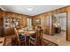 Charming dining room with wood paneling, area rug, and natural light at 908 Clarion Dr, Durham, NC 27705