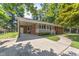 Lovely brick home with an attached carport and manicured landscaping at 908 Clarion Dr, Durham, NC 27705