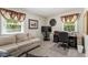 Functional home office space with ample natural light, comfortable seating, and practical storage solutions at 908 Clarion Dr, Durham, NC 27705