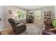 Comfortable living room with a recliner, sofa, and natural light from bright windows at 908 Clarion Dr, Durham, NC 27705