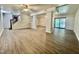 Open basement floor plan with stairs, modern flooring, and sliding doors at 101 Creekside Dr, Selma, NC 27576