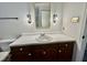 Classic bathroom with white sink, vanity, and decorative lights at 101 Creekside Dr, Selma, NC 27576