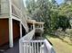 Exterior staircase and balcony with a view of green trees and grass at 101 Creekside Dr, Selma, NC 27576