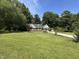 Lovely front yard and exterior view of the home on a sunny day at 101 Creekside Dr, Selma, NC 27576