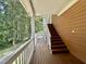 Exterior staircase with white railings leads to backyard at 101 Creekside Dr, Selma, NC 27576