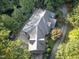 A home with a unique floor plan featuring lush landscaping and a private driveway at 101 Painted Rock Ct, Garner, NC 27529