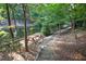 A backyard with a picturesque picnic area by the pond, ideal for outdoor enjoyment at 101 Painted Rock Ct, Garner, NC 27529