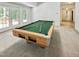 Spacious basement with a pool table, carpeted floors, and large windows at 101 Painted Rock Ct, Garner, NC 27529