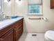 Bathroom featuring a modern vanity with updated fixture and toilet with grab bar at 101 Painted Rock Ct, Garner, NC 27529
