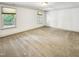 Spacious bedroom with neutral carpeting and two windows at 101 Painted Rock Ct, Garner, NC 27529