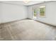 Open bedroom featuring carpet and french door that leads out to a deck at 101 Painted Rock Ct, Garner, NC 27529