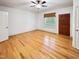 Spacious bedroom with hardwood floors, ceiling fan and natural light from large window at 101 Painted Rock Ct, Garner, NC 27529