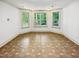 Bright bonus room featuring three windows and patterned vinyl flooring at 101 Painted Rock Ct, Garner, NC 27529