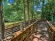 Exterior wooden deck with bridge next to water at 101 Painted Rock Ct, Garner, NC 27529