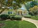 Brick home with large porch and manicured lawn exudes suburban charm at 101 Painted Rock Ct, Garner, NC 27529