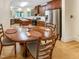 Eat-in kitchen features stainless steel appliances, custom cabinetry, and a spacious dining area at 101 Painted Rock Ct, Garner, NC 27529