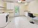 Bright laundry room with modern appliances, sink, desk, and access to outdoor space at 101 Painted Rock Ct, Garner, NC 27529