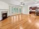 Spacious living room features hardwood floors, a fireplace, and seamless access to the kitchen and dining area at 101 Painted Rock Ct, Garner, NC 27529