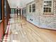 Bright sunroom with hardwood flooring, brick walls and many windows at 101 Painted Rock Ct, Garner, NC 27529