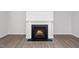 Close-up of the modern fireplace with white mantle, creating a cozy atmosphere at 1022 Homecoming Way, Durham, NC 27703