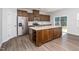Spacious kitchen featuring stainless steel appliances, a large island, and ample cabinet space at 1022 Homecoming Way, Durham, NC 27703