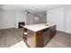 Spacious kitchen island with stainless steel appliances and open concept living area at 1022 Homecoming Way, Durham, NC 27703