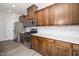 Close-up of the kitchen showing stainless steel appliances, white backsplash, and wood cabinets at 1022 Homecoming Way, Durham, NC 27703