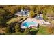 Estate aerial view showcasing a pool, lush landscaping, and multiple structures at 105 Abbotsford Ct, Durham, NC 27712